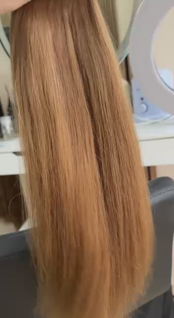 Video showing the flexibility and shine of a 60 cm (24 inch) premium raw Slavic straight hair extension in Brown color