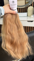 40 cm (16 inch) premium raw Slavic wavy hair extension, cold-bleached Honey Blonde color, single donor