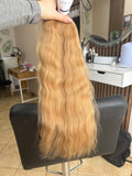 55 cm (22 inch) premium raw Slavic wavy hair extension, cold-bleached Honey Blonde color, single donor