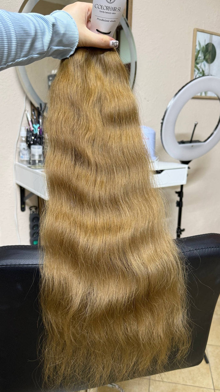 65 cm (26 inch) premium raw Slavic wavy hair extension, cold-bleached Honey Blonde color, single donor
